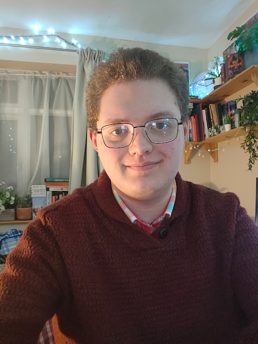 Andrew in a burgundy jumper, inside